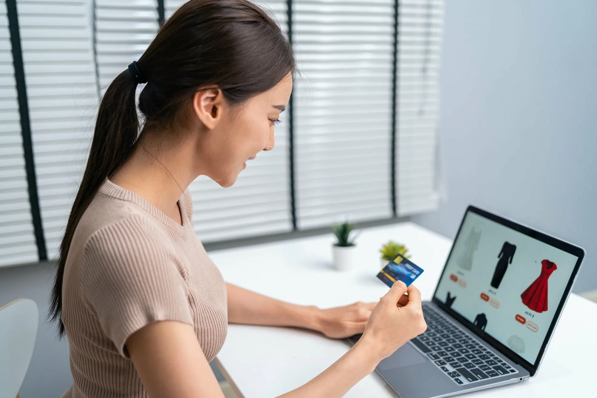 Asian young woman use laptop computer for shopping product sell online. - ecommerce product page