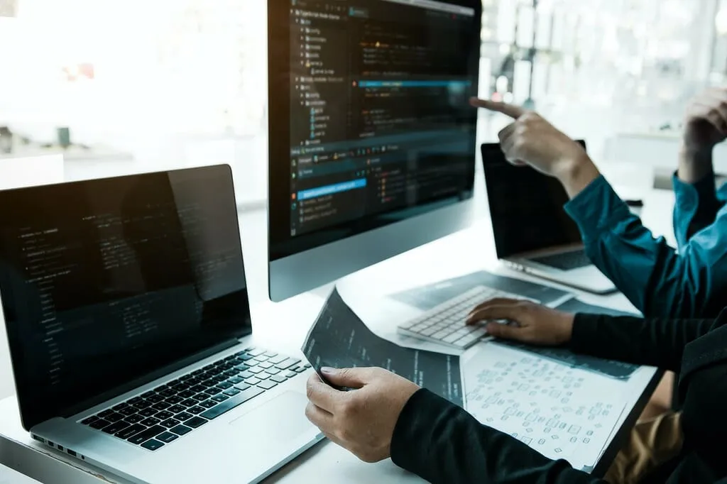 team working development of programming and encryption technology from a web development company in Malaysia