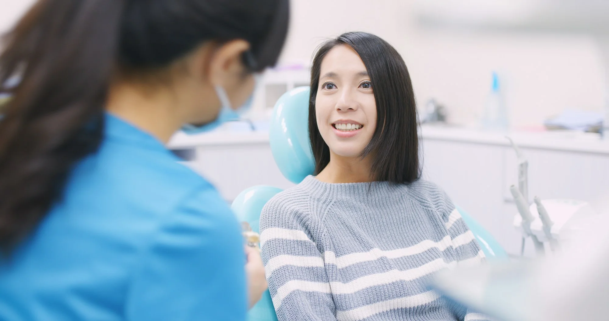 Woman talk to dentist in dental clinic