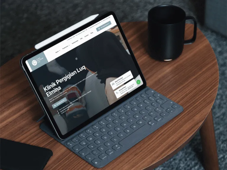 iPad on a wooden table displaying a website about penguin conservation, with a coffee mug nearby.